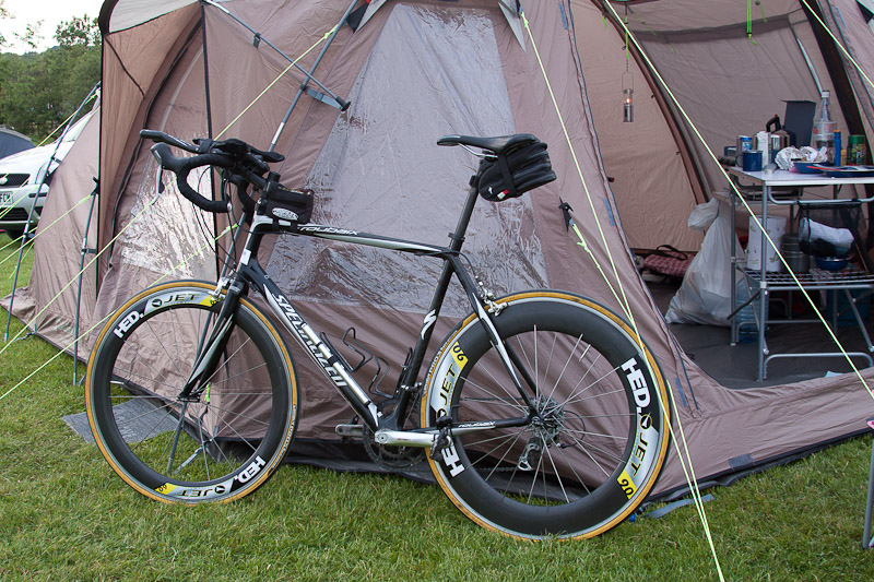 Bike, race wheels and tent.