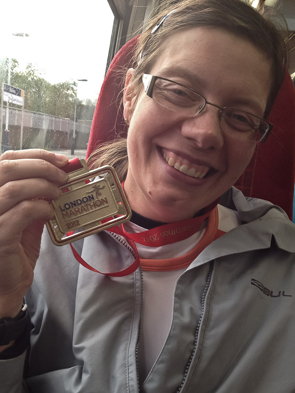 Sharon with her medal on the way home